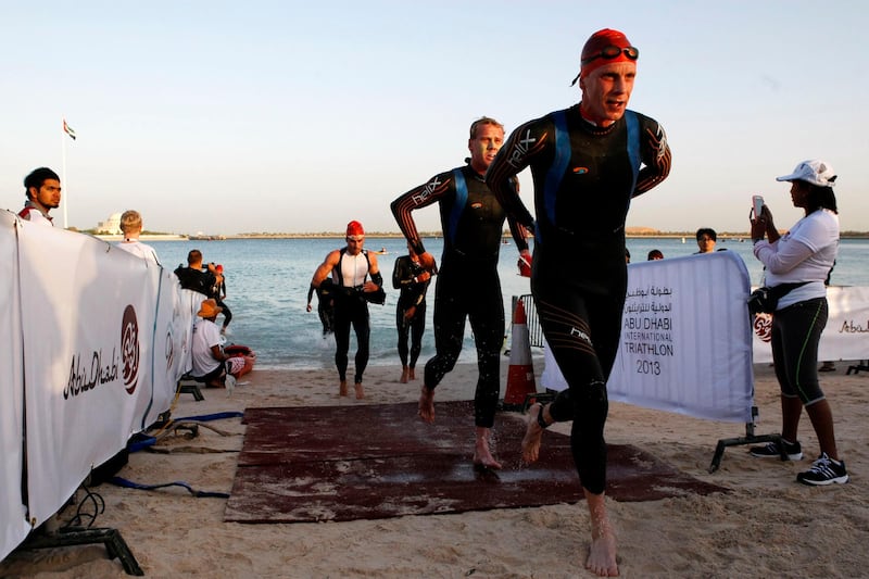 Abu Dhabi, United Arab Emirates, March 2, 2013:    Elite male long distance triathletes exit the water during the swim section of the Abu Dhabi International Triathlon in Abu Dhabi on March 2, 2013. Christopher Pike / The National