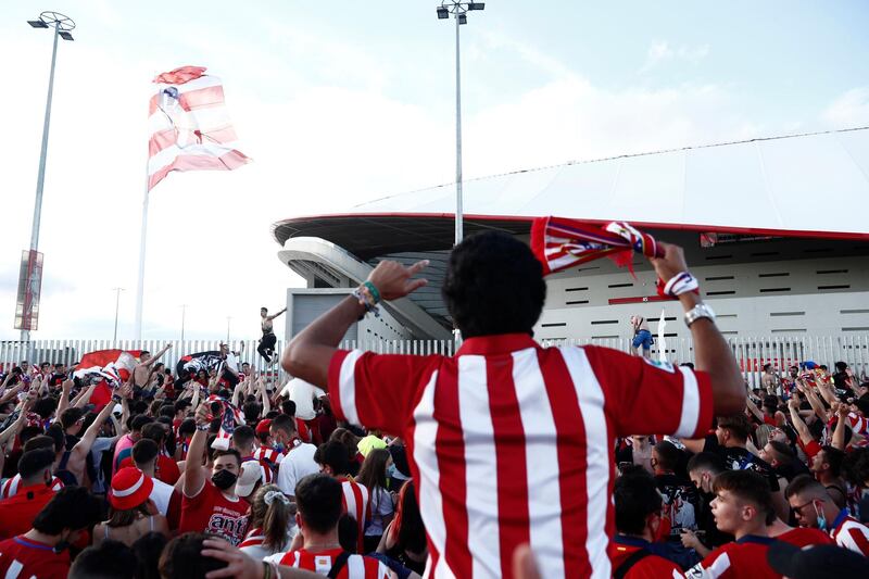 Atletico Madrid fans celebrate outside the stadium after the match. Reuters