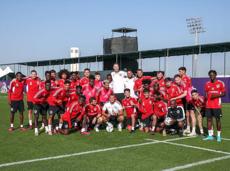 Steven Taylor poses with his Gulf United players.