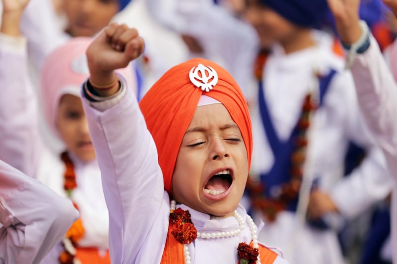 A young Sikh devotee chants during a procession in Amritsar, India.  EPA