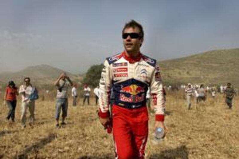 Sebastien Loeb leaves the site where he crashed out during the Klenia Mycenae special stage of the WRC Acropolis rally.
