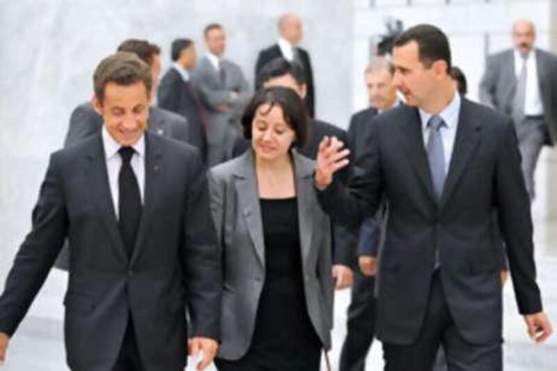 The Syrian president Bashar al-Assad, right, speaks with the French president Nicolas Sarkozy as he leaves a summit on indirect peace talks between Syria and Israel in Damascus.
