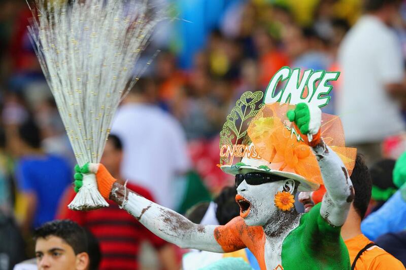 A fan of the Ivory Coast cheers on his team in Recife, Brazil. Jamie Squire / Getty Images