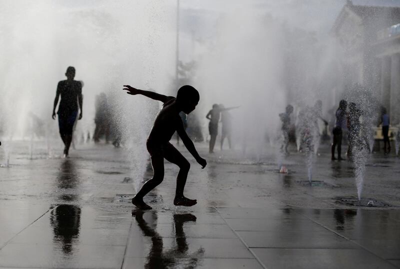 A child plays in the musical fountain at the 'Plaza 22 de Agosto' in Managua, Nicaragua. Reuters