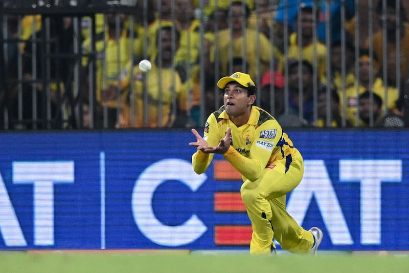 Chennai Super Kings' Rachin Ravindra takes a catch to dismiss Royal Challengers Bangalore's captain Faf du Plessis. AFP