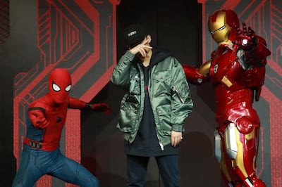 (FILES) This file photo taken on September 4, 2017 shows Chinese rapper PG One (C) performing during a promotional event for the movie "Spiderman: Homecoming" in Beijing.
Chinese music fans are bracing for a crackdown on hip hop after a rapper was apparently dropped from a popular singing programme, as reports emerged that the often-provocative genre had fallen out of official favour. / AFP PHOTO / - /  - China OUT