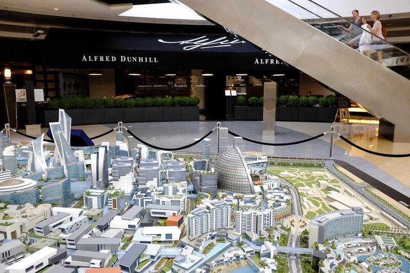 Above, the scale model of the Mall of World on display at Emirates Tower, which will be the world's largest shopping centre when built. Antonie Robertson / The National