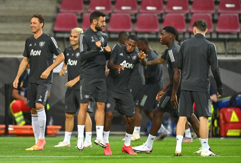 Manchester United players warm up during a training session ahead of the Europa League quarter-final match against FC Copenhagen in Cologne, Germany. Getty Images