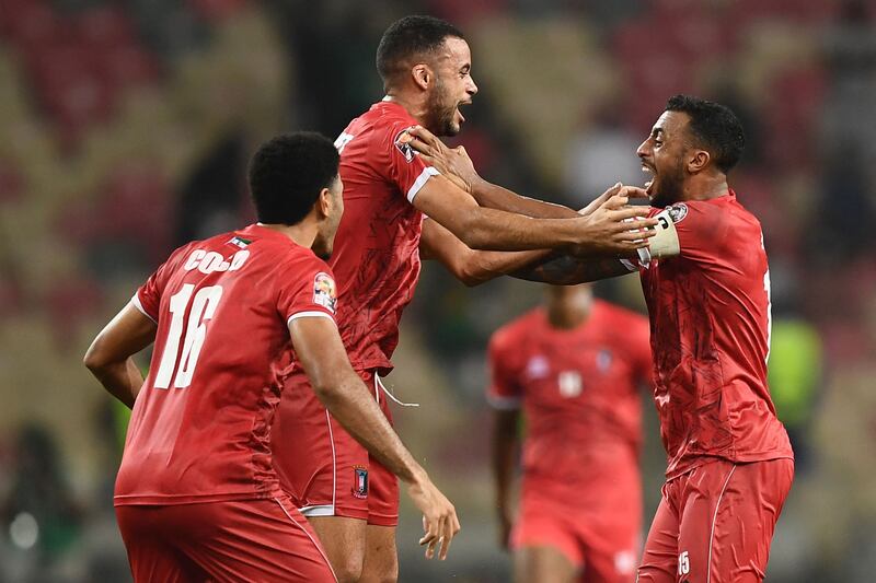 Equatorial Guinea defender Carlos Akapo celebrates with teammates after Equatorial Guinea won the Group E Africa Cup of Nations match against Algeria. AFP