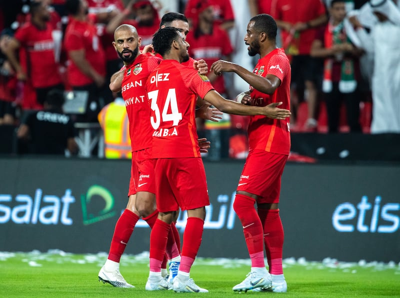 Shabab Al Ahli players celebrate after scoring the opening goal.