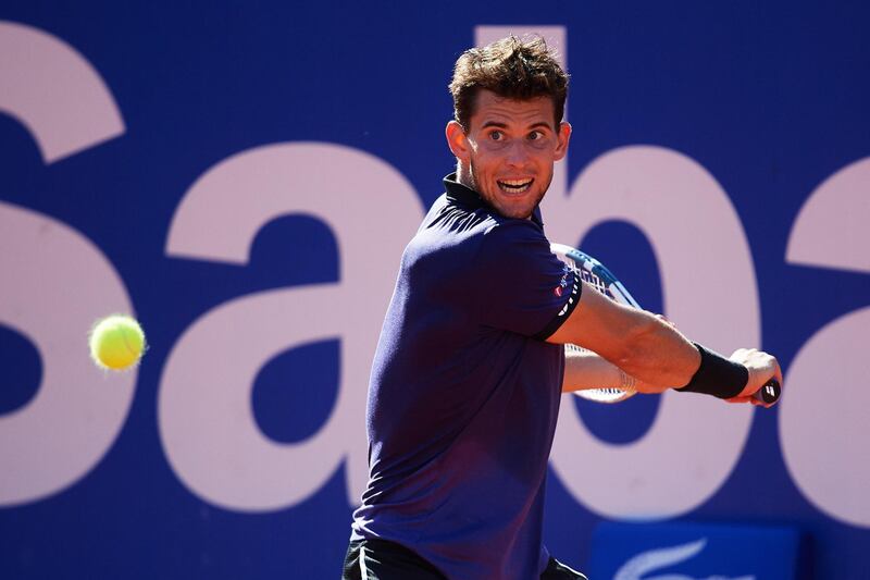 BARCELONA, SPAIN - APRIL 27: Dominic Thiem of Austria plays a backhand against Rafael Nadal of Spain during their semifinal match during day six of the Barcelona Open Banc Sabadell at Real Club De Tenis Barcelona on April 27, 2019 in Barcelona, Spain. (Photo by Alex Caparros/Getty Images)