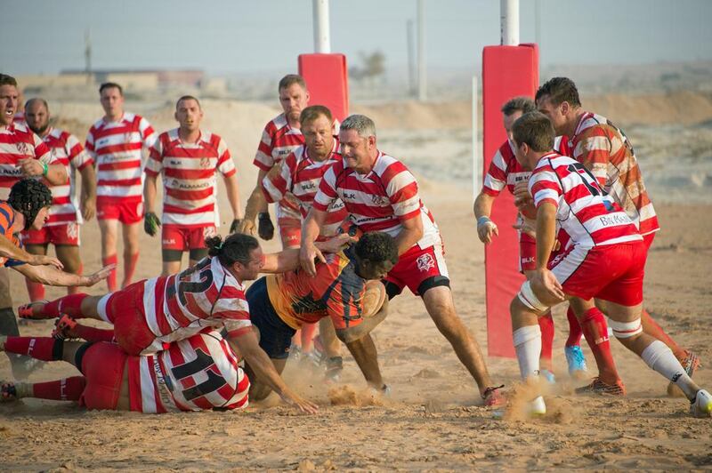 RAK Goats, in red and white stripes, hosted Arabian Knights in a preseason friendly on their new sand pitch at the Bin Majid Beach Resort, Ras Al Khaimah. Courtesy / Roger Harrison