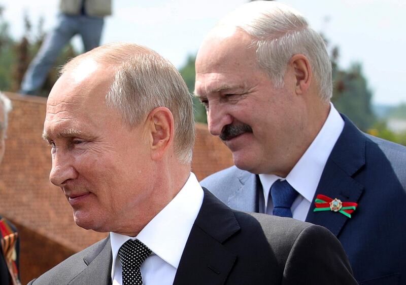 Russian President Vladimir Putin, left, and Belarusian President Alexander Lukashenko greet WWII veterans in June. AP