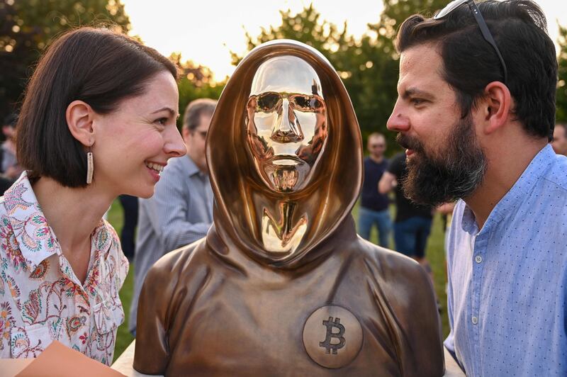 Hungarian sculptors and creators Reka Gergely, left, and Tamas Gilly with their creation