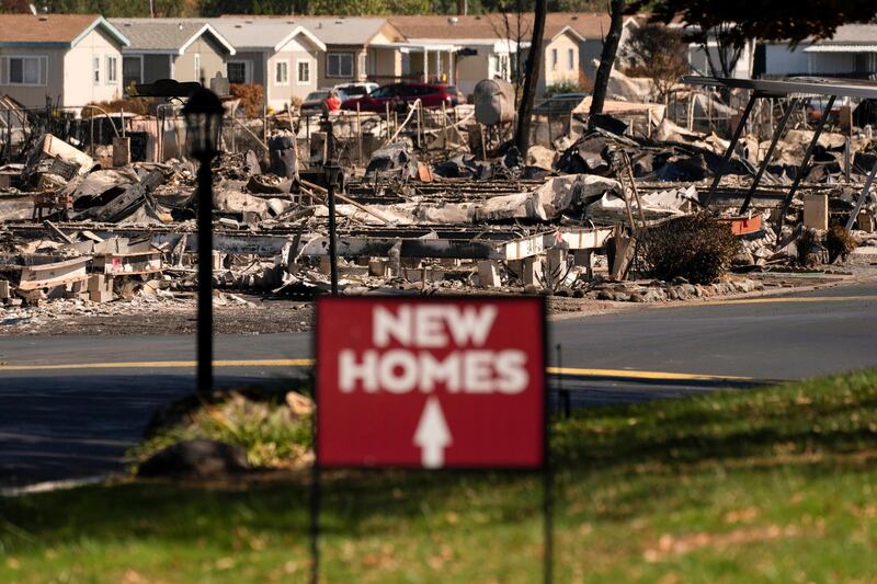 A sign advertising new homes stands in a neighbourhood severely damaged by wildfire in Medford, Oregon, US. Reuters