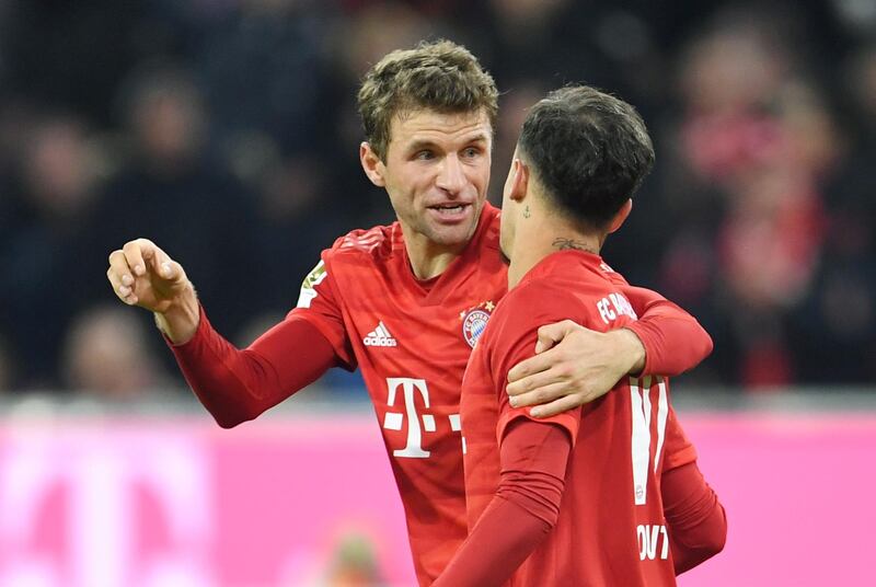 Thomas Muller celebrates with Philippe Coutinho. Reuters