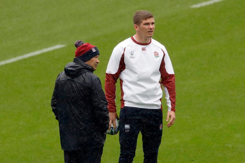 England coach Eddie Jones, left, speaks with Owen Farrell during a training session. AP