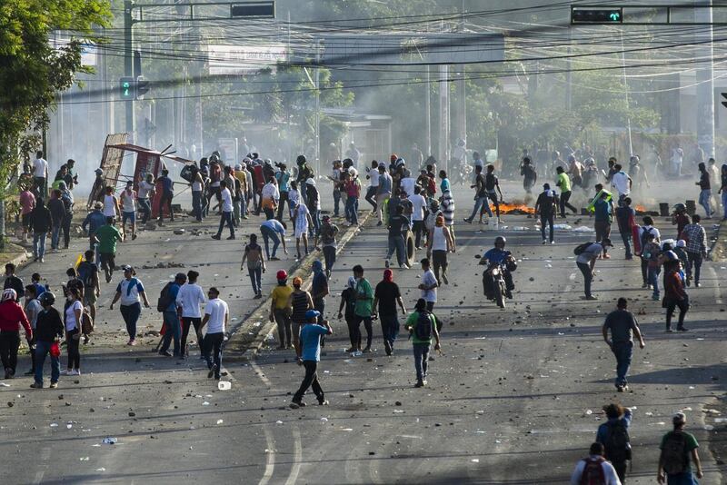 Dozens of protesters block a university avenue in Managua, Nicaragua. Jorge Torres / EPA