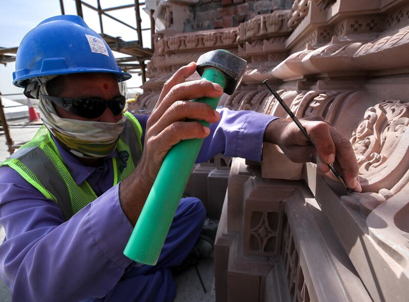 A sculptor at the Baps Hindu temple in Abu Dhabi. Victor Besa / The National