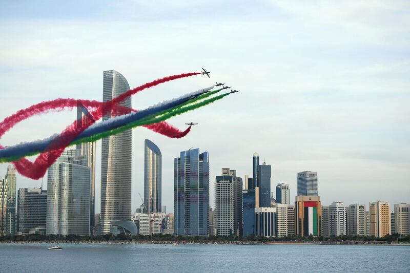 Abu Dhabi, United Arab Emirates - Al Fursan aerobatic demonstration lights up the skyline of Abu Dhabi on December 2, 2018. (Khushnum Bhandari/ The National)
