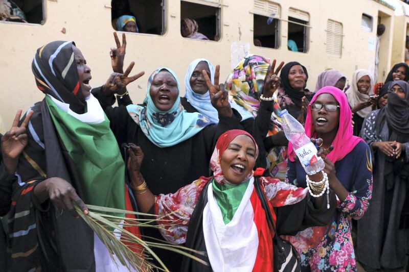 Sudanese pro-democracy supporters celebrate a final power-sharing agreement with the ruling military council Saturday, Aug 17, 2019, in the capital, Khartoum. The deal paves the way for a transition to civilian-led government following the overthrow of President Omar al-Bashir in April. (AP Photo)