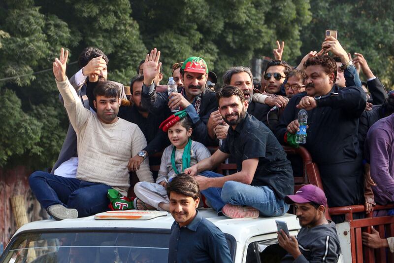 Pakistan Tehreek-e-Insaf party senior vice president Sher Afzal Marwat (top centre) leads a campaign rally in Hyderabad before the Pakistani general election. AFP
