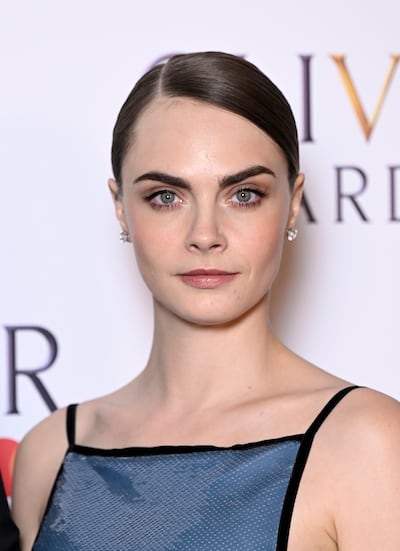 Cara Delevingne is known for sporting naturally heavy eyebrows. Getty Images