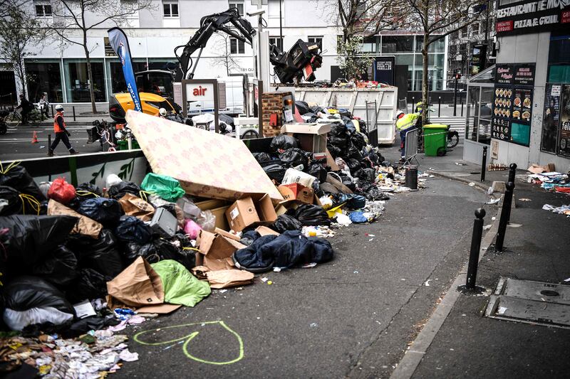 Piles of rubbish on a pavement in Paris. AFP