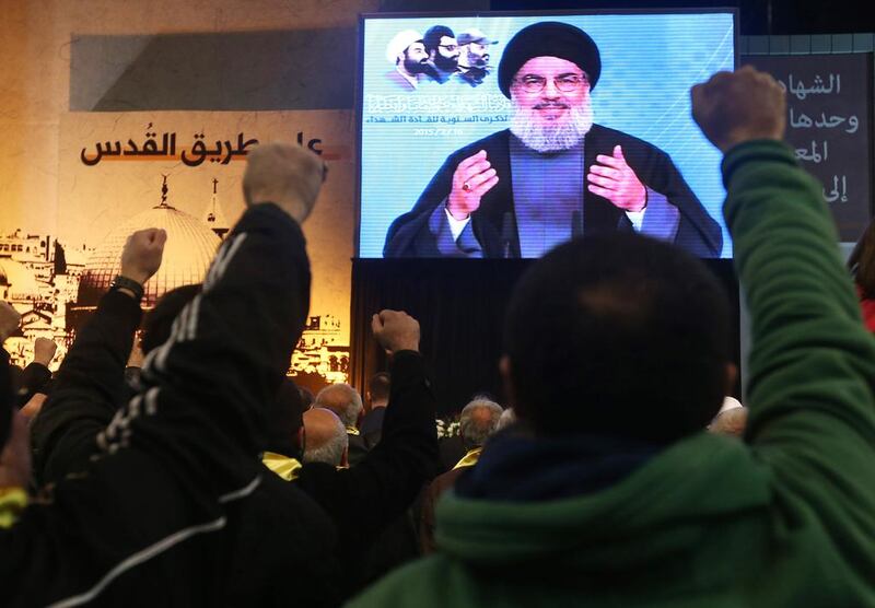 Hizbollah's Hassan Nasrallah speaks via video link in Beirut on February 16. Hussein Malla / AP Photo