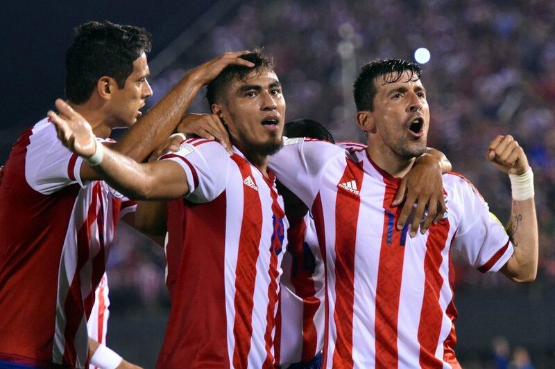 Paraguay’s Dario Lezcano (C) celebrates with teammates after scoring against Brazil during their Russia 2018 Fifa World Cup South American Qualifiers’ football match in Asuncion, on March 29, 2016. AFP PHOTO / PABLO BURGOS