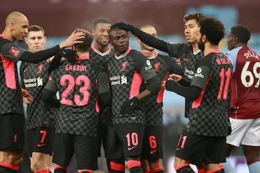 Liverpool's Sadio Mane celebrates scoring their third goal against Aston Villa. Reuters