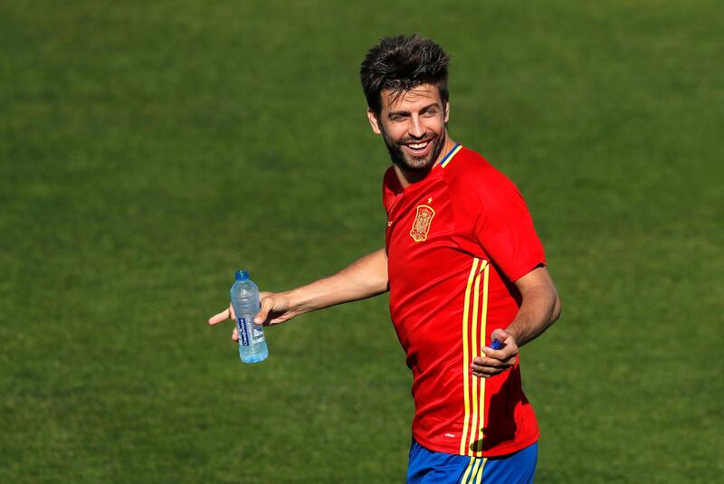 FILE- In this Friday, June 24, 2016 file photo, Spain's Gerard Pique gestures during a training session at the Sports Complex Marcel Gaillard in Saint Martin de Re in France. Spain coach Julen Lopetegui praised Gerard Pique's commitment to the national team and called on the squad to be focused only on soccer despite the crisis involving Catalonia's push for independence. (AP Photo/Manu Fernandez, File)