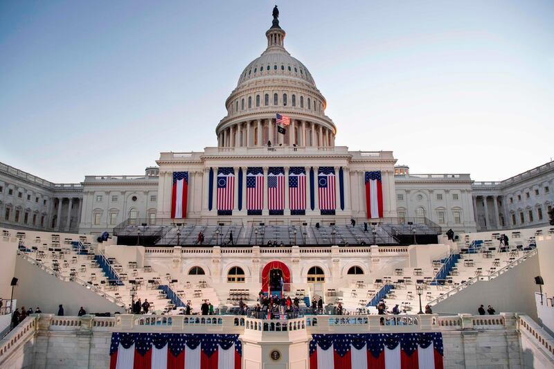 The sun rises behind the US Capitol as preparations are made prior to the 59th inaugural ceremony for President-elect Joe Biden and Vice President-elect Kamala Harris on the West Front of the US Capitol in Washington. AFP