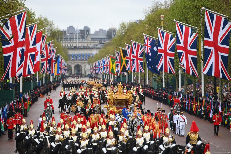 King Charles and Queen Camilla travelling in the Gold State Coach down The Mall on route to Buckingham Palace during the coronation in May 