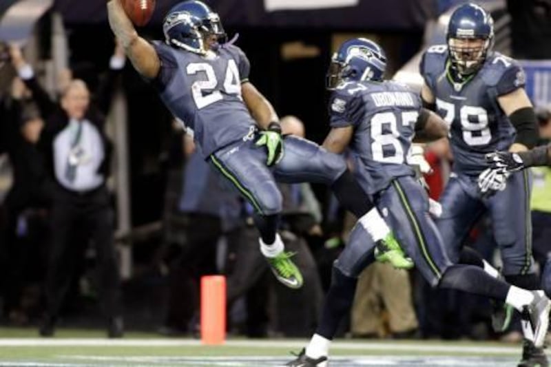 Seattle Seahawks running back Marshawn Lynch (L) leaps backwards in celebration as he jumps into the end zone to score on a long run in the fourth quarter of play against the New Orleans Saints as teammates Ben Obomanu (C) and Tyler Polumbus (R) follow during their NFC Wildcard playoff NFL game in Seattle, January 8, 2011. REUTERS/Robert Sorbo (UNITED STATES - Tags: SPORT FOOTBALL) *** Local Caption ***  SEA24_NFL-_0109_11.JPG