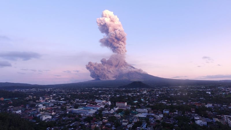 A column of ash shoots up from the Mayon volcano as it continues to erupt, seen from the city of Legazpi in Albay province, south of Manila. Charism Sayat / AFP
