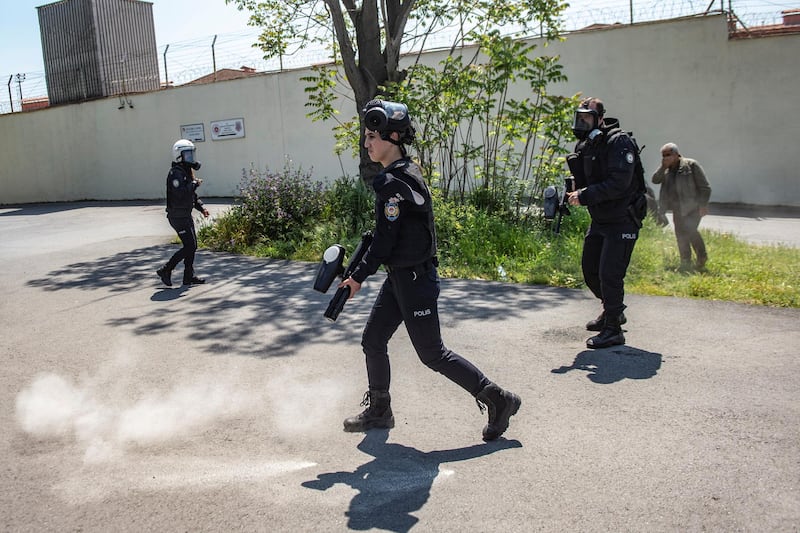 Turkish anti-riot police officers use teargas during a demonstration in solidarity with prisoners on hunger strike in front of the Bakerkoy prison in Istanbul on May 3, 2019. - Thousands of prisoners are on hunger strike in a bid to improve the detention conditions of Abdullah Ocalan, co-founder of the outlawed Kurdistan Workers' Party (PKK). Ocalan has been serving a life sentence for treason in an island prison near Istanbul since his capture in 1999. He has not had access to his lawyers since 2011. (Photo by Yasin AKGUL / AFP)