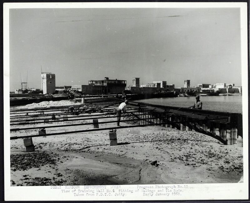 Improvement works at Dubai harbour in 1959/1960. Note the wind towers in the houses along the waterfront. Crown Copyright Images 