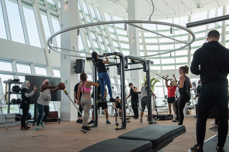 Employees take time to work out in the gym.