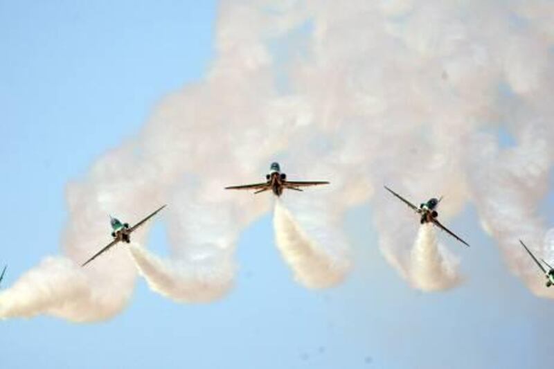 February 4, 2011 / Abu Dhabi/ Members of the Saudi Hawks perform aerial maneuvers during the Al Ain Air Show February 4, 2011. (Sammy Dallal / The National)