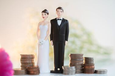 Partners should confide in each other about their financial situation, debts owed, spending habits, and goals for retirement or buying property, before they walk down the aisle. Photo: Getty Images