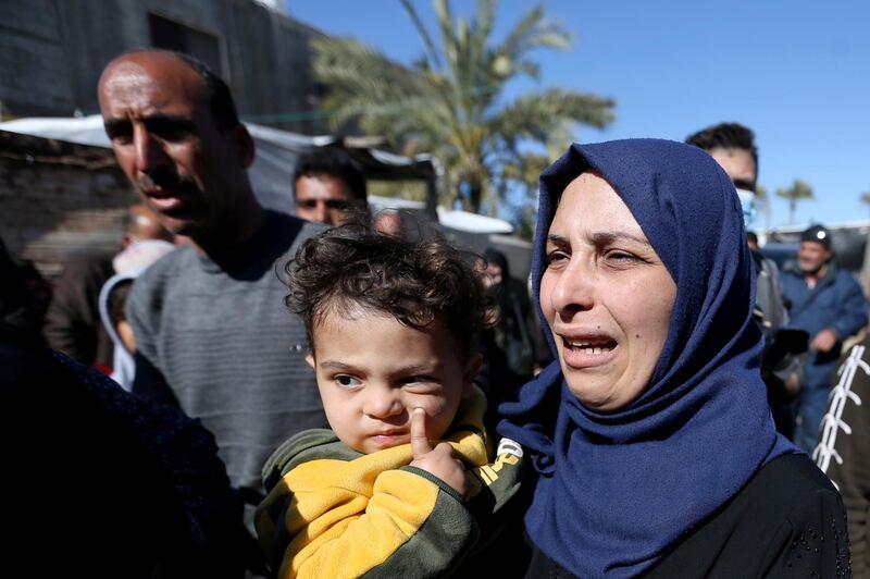 Relatives of three Palestinian fishermen from Allaham family mourn during their funeral in Khan Younis in the southern Gaza Strip. Reuters