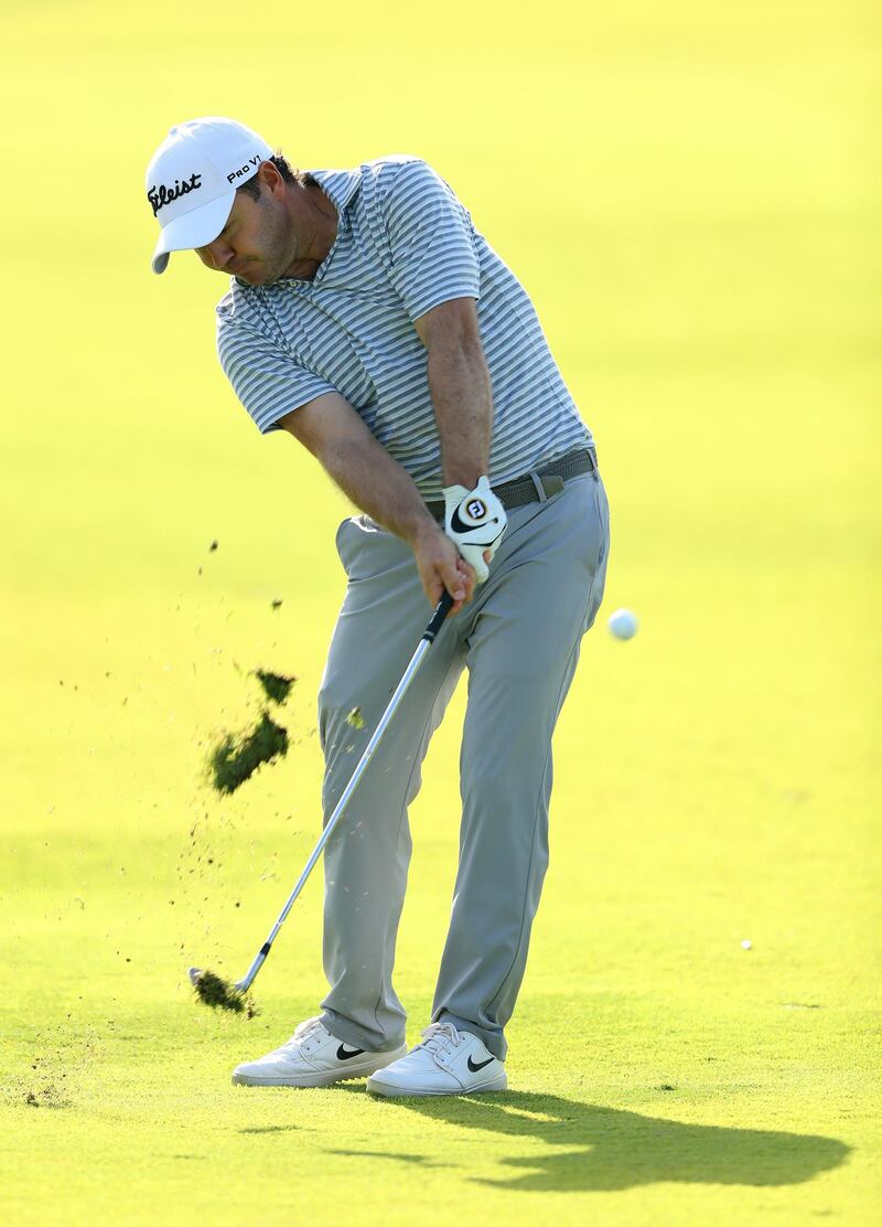 First-round leader Richard Sterne of South Africa plays his second shot on the second  on his way to a 64 in Dubai. Getty