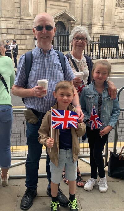 Len and Myra Ellis from Chester with their grandchildren stand outside St Paul's Cathedral in London on Friday, where a service of thanksgiving was held for Queen Elizabeth II's platinum jubilee. The National