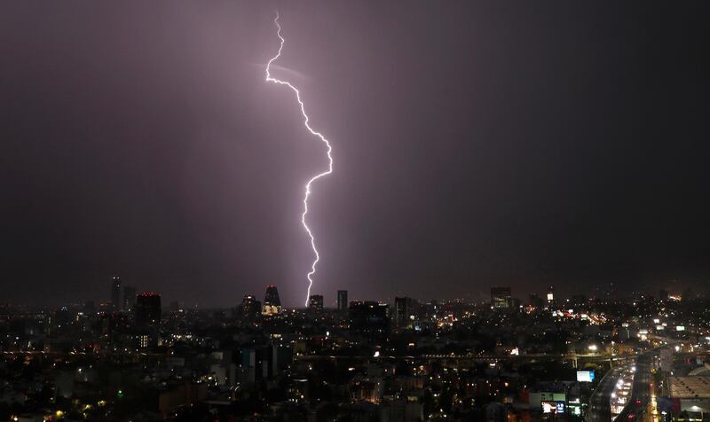 A bolt of lightning strikes during a storm in Mexico City. AP Photo