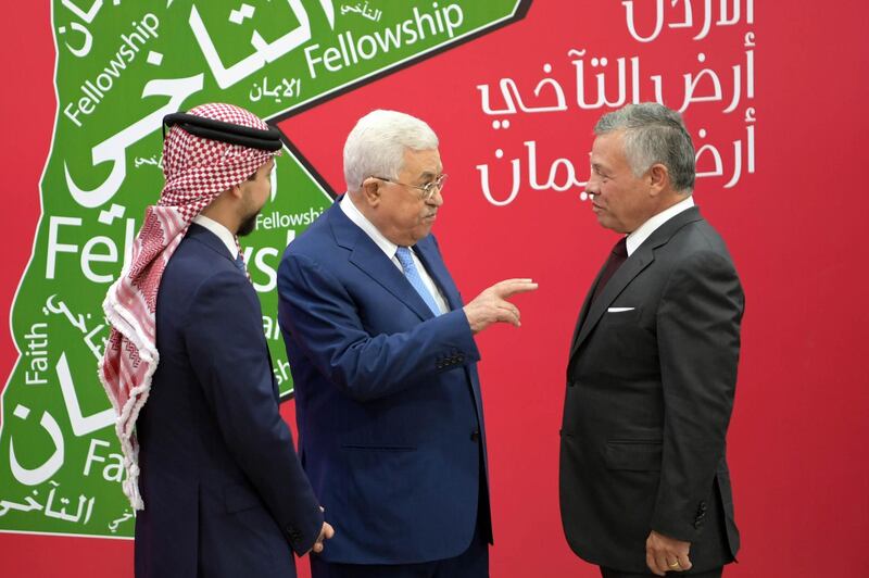 Jordan's King Abdullah II, right; his son Crown Prince Hussein, left; and Palestinian president Mahmoud Abbas attend the churches' celebrations of Christmas at the Al-Hussein Cultural Centre in Amman, Jordan. AFP