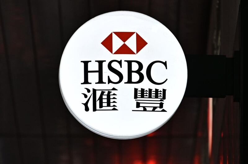 This picture taken on May 2, 2019 shows an illuminated HSBC logo outside one of its branches in Hong Kong. The London-headquartered HSBC banking behemoth was expected to release its first quarter results later on May 3. / AFP / Anthony WALLACE
