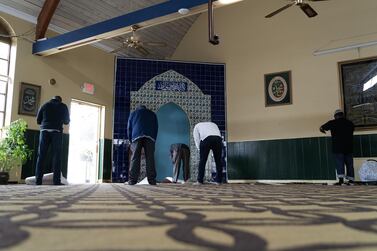 Worshippers perform dhuhr prayers inside the Masjid Muhammad in Washington on the first day of Ramadan. Willy Lowry / The National