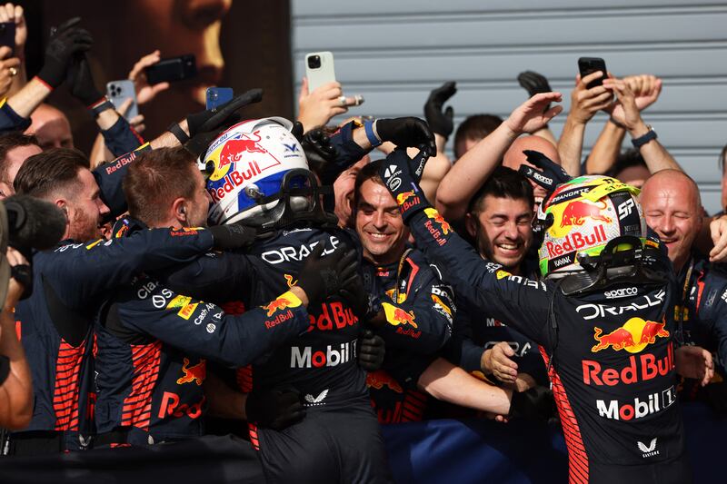 Red Bull's Max Verstappen celebrates winning the Italian Grand Prix with second-placed teammate Sergio Perez. Reuters