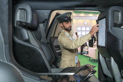 Abu Dhabi, U.A.E., February 18, 2019. INTERNATIONAL DEFENCE EXHIBITION AND CONFERENCE  2019 (IDEX) Day 2--  Lt. Saeed Mohd Matar Almazrooei.
uses the touch screen system of the  Dubai Police GHIATH Mobile.
Victor Besa/The National